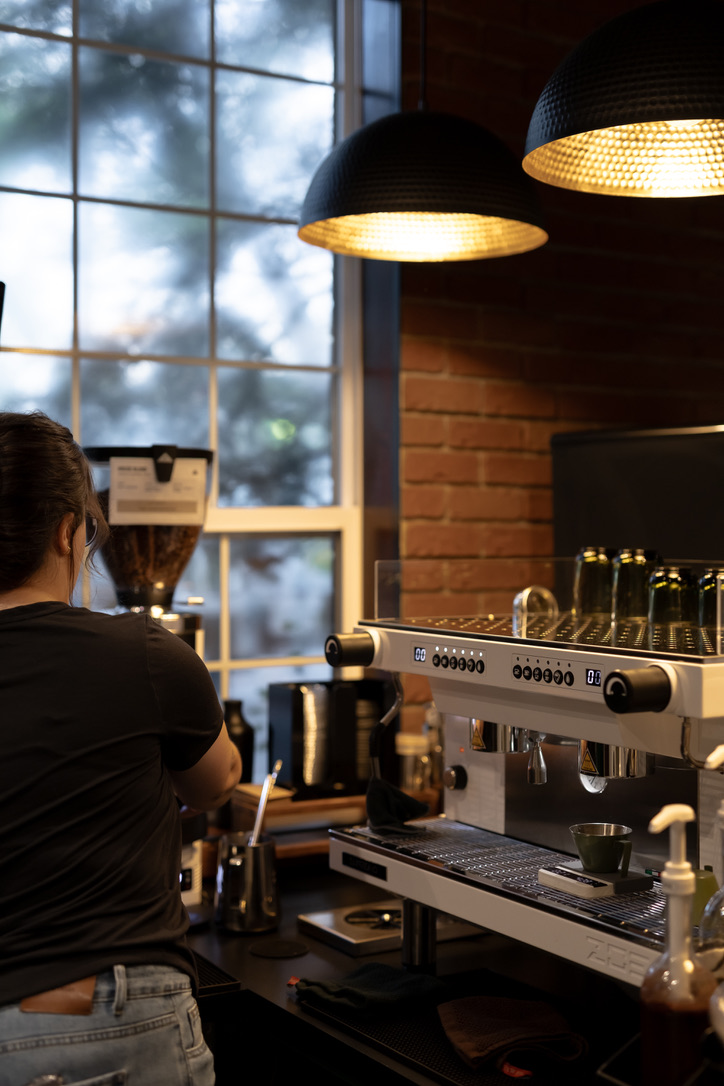 Barista preparing espresso at Neighborhood Park + Coffee